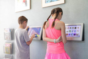 Children playing on iPad